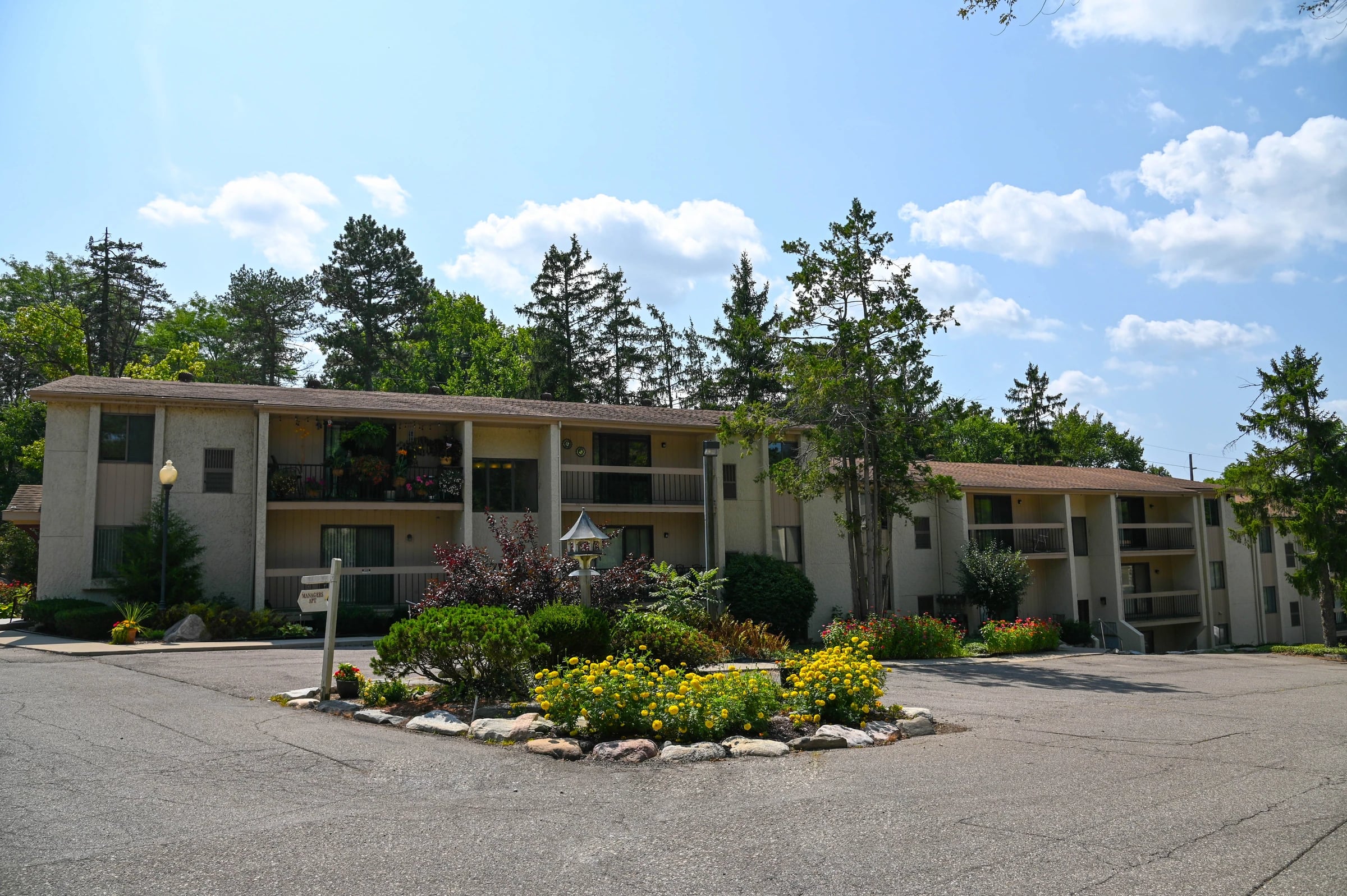 Paint Creek apartments with balconies and a landscaped courtyard